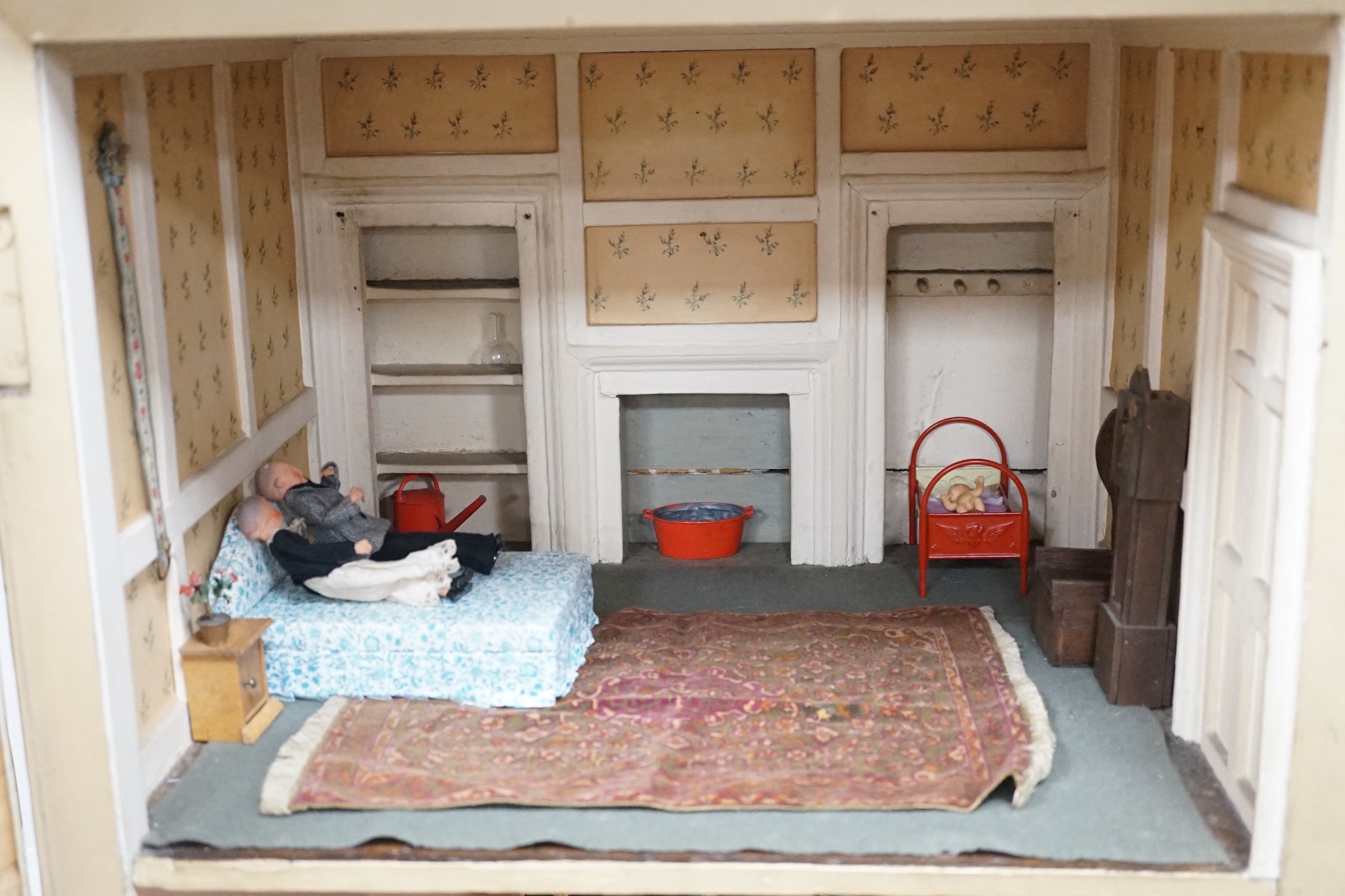 An early 19th century painted doll's house with block work facade enclosing a four room interior with central staircase, to be sold with assorted later furniture and accessories, width 117cm, depth 48cm, height with asso